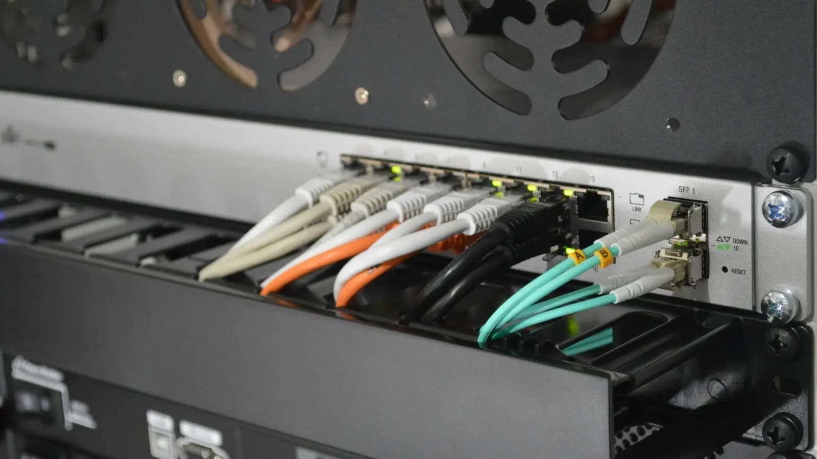Network switch rack with fiber and ethernet patch cables